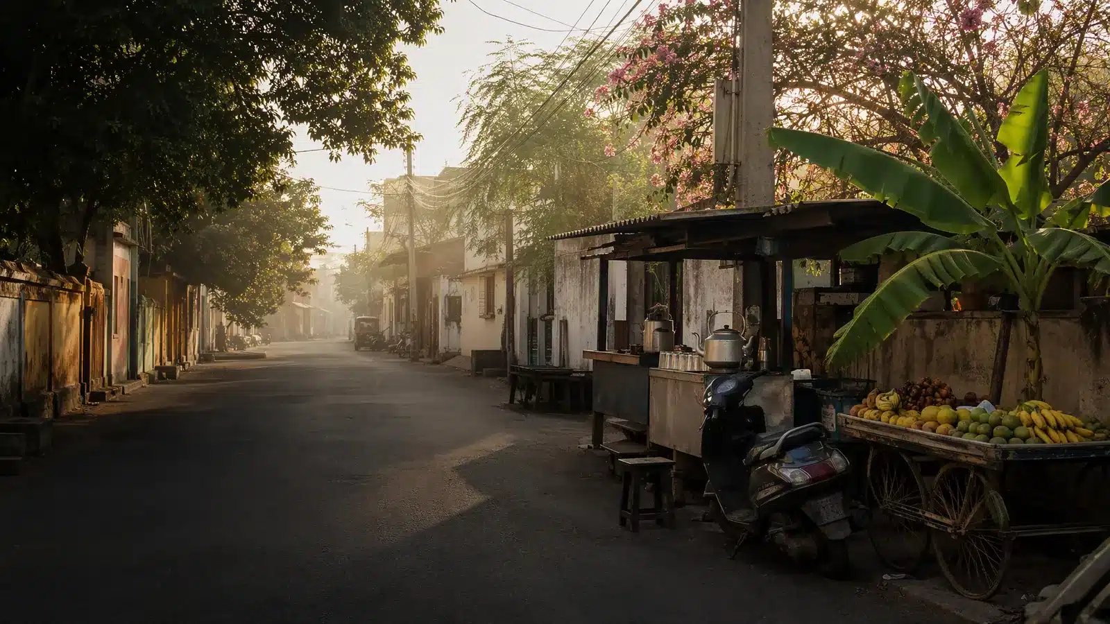 Illustrative neighbourhood street in India with a roadside tea stall and a parked scooter