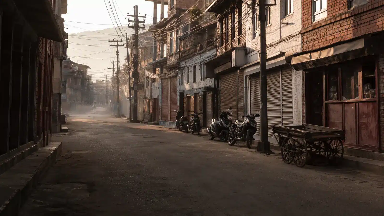 Illustrative neighbourhood lane in Nepal with brick buildings, closed shutters and a wooden handcart